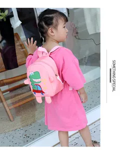 Detailed view of pink toddler dinosaur backpack with adjustable shoulder straps