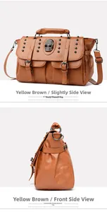Detail view of the skull ornament and metal studs on brown leather crossbody bag