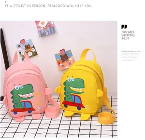 Close-up of pink and yellow toddler dinosaur backpacks with adjustable shoulder straps