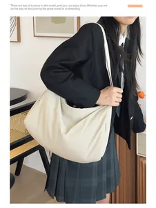 Large cream nylon crossbody bag shown on model with minimalist campus style aesthetic
