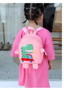 Pink canvas toddler crossbody bag with cute cartoon dinosaur design and pink strap