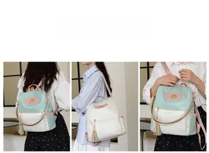 Détail du sac à dos en tissu Oxford avec bretelles doubles et pendentif à pampilles