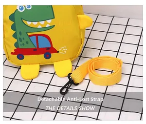 Detail view of the detachable anti-lost safety rope on a yellow dinosaur toddler backpack
