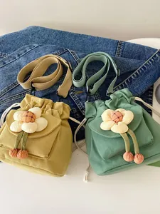 Cute canvas mini drawstring bucket bag with 3D flower detail and tassel straps