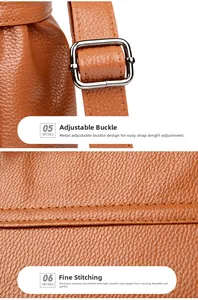 Detailed macro view of brown lychee grain leather stitching and silver metal buckle