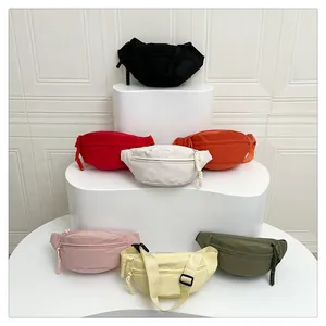 Detailed display of colorful nylon crossbody chest bags in seven different solid colors