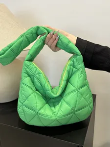 Bright green quilted cloud bag with padded nylon finish and stylish knot handle design