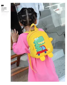 Rear view of a child wearing a bright yellow cartoon dinosaur backpack with pink clothing