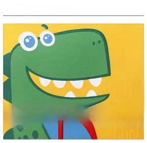 Detail of yellow canvas kids bag with green dinosaur print and Follow Me text