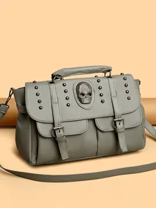 Vintage gray leather crossbody bag with skull emblem and silver rivet details