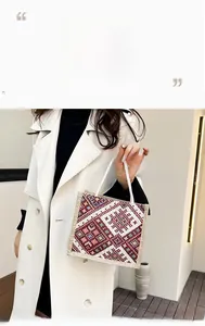 Detailed texture of geometric diamond pattern and white rope handle on linen handbag