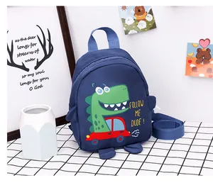 Close-up of navy blue toddler backpack with dinosaur cartoon and adjustable straps