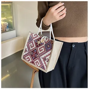 Ethnic mini linen tote bag with geometric woven patterns and round wooden button detail