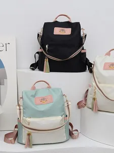 Sac à dos chic en tissu Oxford avec couleurs contrastées et sangles rayées pour femme