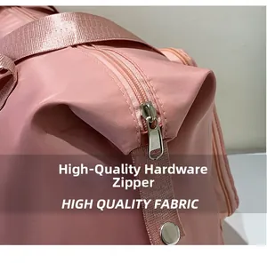 Detailed close-up of pink nylon travel bag featuring high-quality hardware metal zipper