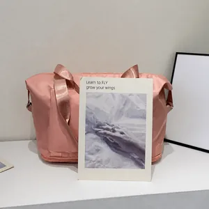 Detail of a pink large capacity travel bag showing the high quality fabric texture