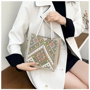 Ethnic geometric pattern embroidery on linen tote bag with white braided cotton handles