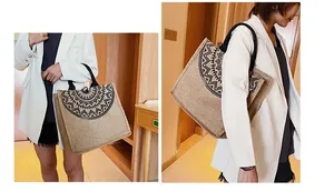 Detalle del bolso tote de lino con estampado de mandala negro y asas de transporte