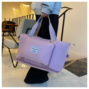 Detail of light purple waterproof nylon travel bag with thick handles and expansion zipper