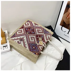 Detailed shot of ethnic canvas tote featuring geometric patterns and woven cotton rope handles