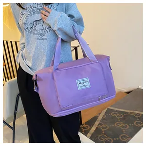 Purple waterproof travel bag with large capacity and a separate bottom shoe compartment
