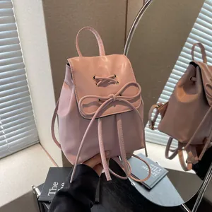 Sac à dos rose en cuir PU avec nœud élégant et design à lacets croisés tendance