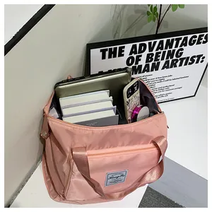 Pink large capacity travel bag showing organized interior storage for tablet and makeup