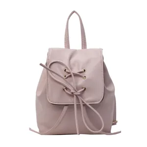 Grand sac à dos rose en similicuir pour femme avec lacets croisés et poignée haute