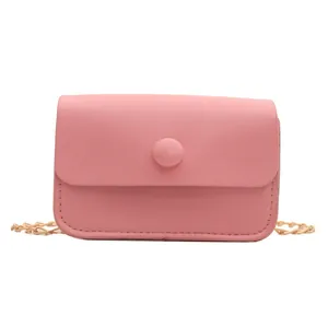 Minimalist light pink small flap crossbody bag with golden chain strap and round buckle