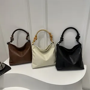 Minimalist hobo bags with wooden bead handles in vintage brown, beige and black colors