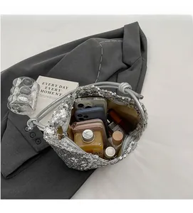 Detail view of large capacity silver sequin tote bag showing interior storage for essentials