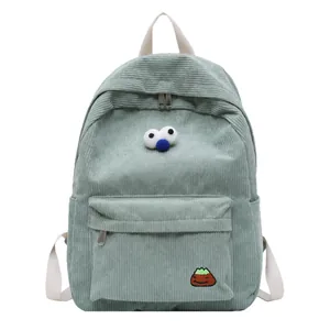 Light green corduroy backpack for students featuring 3D cartoon eyes and mountain embroidery