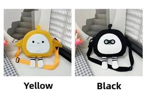 Detail of yellow and black canvas crossbody bags with cartoon faces and striped legs