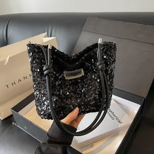 Stylish black sequin tote bag with FASHION label and leather knot straps for women
