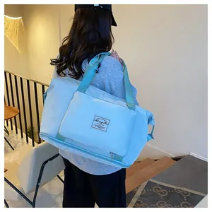 Light blue foldable travel bag with waterproof nylon fabric and expandable bottom layer