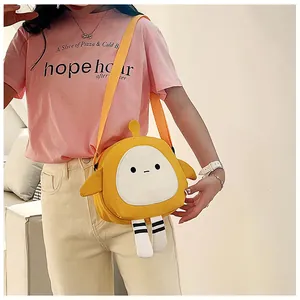 Close-up of cute yellow cartoon canvas crossbody bag with detailed embroidery and long legs