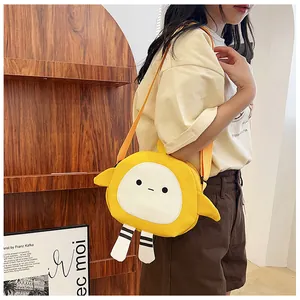 Detail of yellow round cartoon canvas crossbody bag featuring cute wings and striped legs