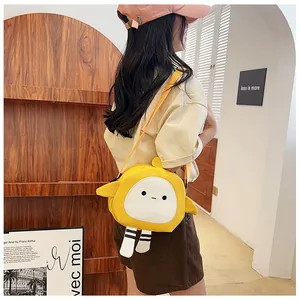 Detail of a yellow cartoon canvas crossbody bag featuring cute expression and 3D striped legs