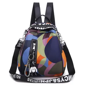 Colorful patterned oxford cloth backpack with cartoon bear charm and letter straps