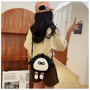 Detail view of cute cartoon crossbody canvas bag with character legs on female model