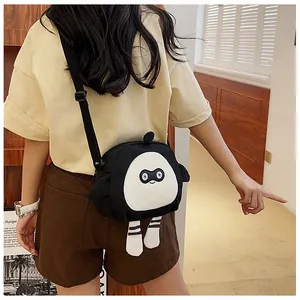Detailed view of cartoon crossbody bag with stripe legs and adjustable strap on a model