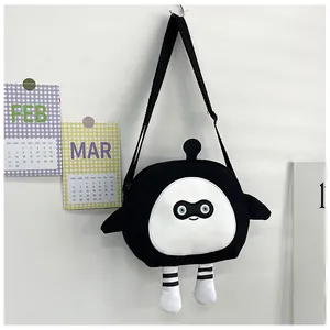 Detail of cartoon character crossbody bag with cute wings and striped legs on white background