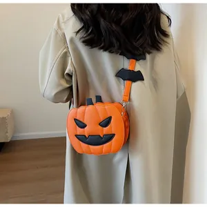 Fashionable Halloween pumpkin crossbody bag with bat detail shown on model back