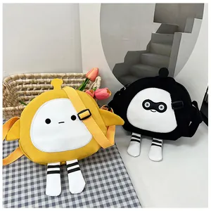 Detail of yellow and black cartoon canvas crossbody bags with cute leg-shaped accents