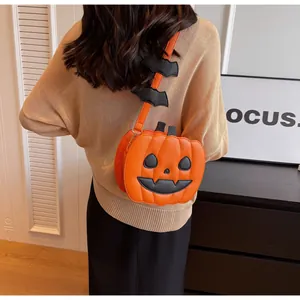 Creative pumpkin crossbody bag with bat wing strap for Halloween fashion outfits