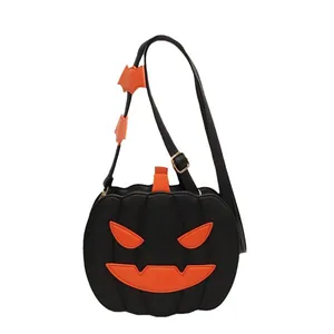Black pumpkin crossbody bag with orange face and bat ornaments for Halloween fashion