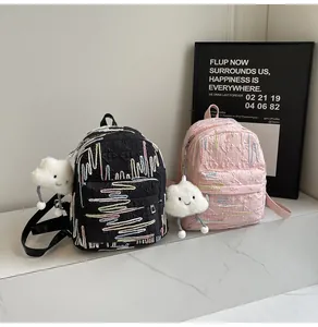 Quilted mini backpack with colorful embroidery and white plush cloud charm detail