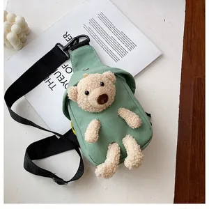 Green canvas crossbody bag with a cute 3D plush teddy bear and adjustable strap