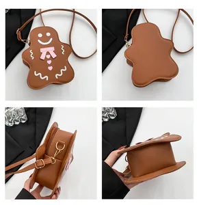 Vue détaillée du sac bandoulière bonhomme pain d'épice en cuir PU marron avec zip