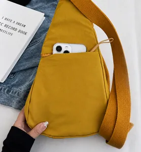 Detail of canvas chest bag featuring a secure back hidden zipper pocket for smartphones